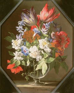 A Vase of Flowers on a Stone Ledge Containing Tulips, Chrysanthemums, Dahlias and Narcissi